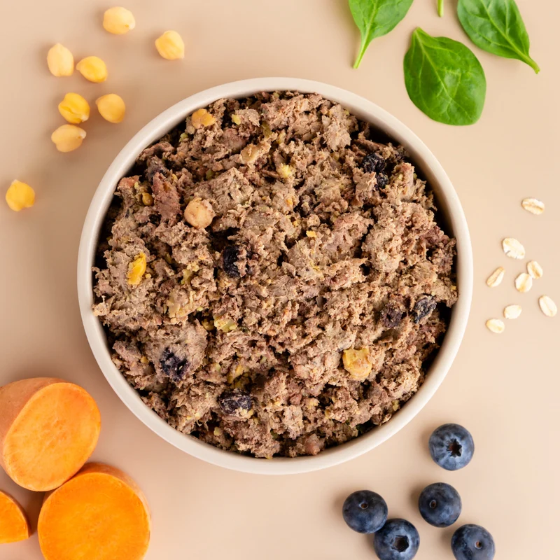 A bowl of DASH beef recipe shown with sweet potato, spinach, chickpeas, oats and blueberries